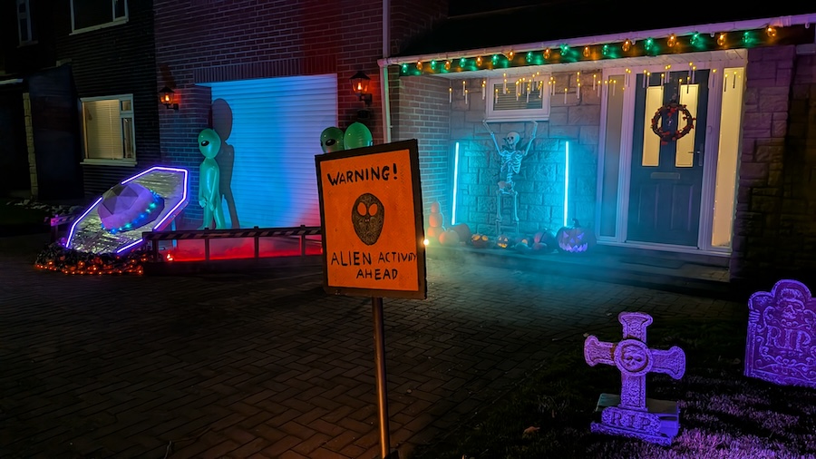Wide view of the scene, focusing on the Aliens Ahead warning sign in the foreground.